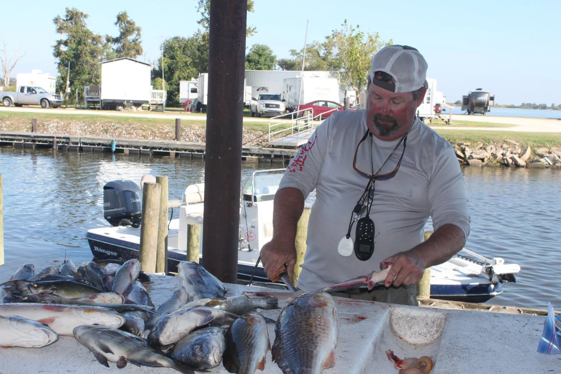 Captain Doc cleaning a successful catch