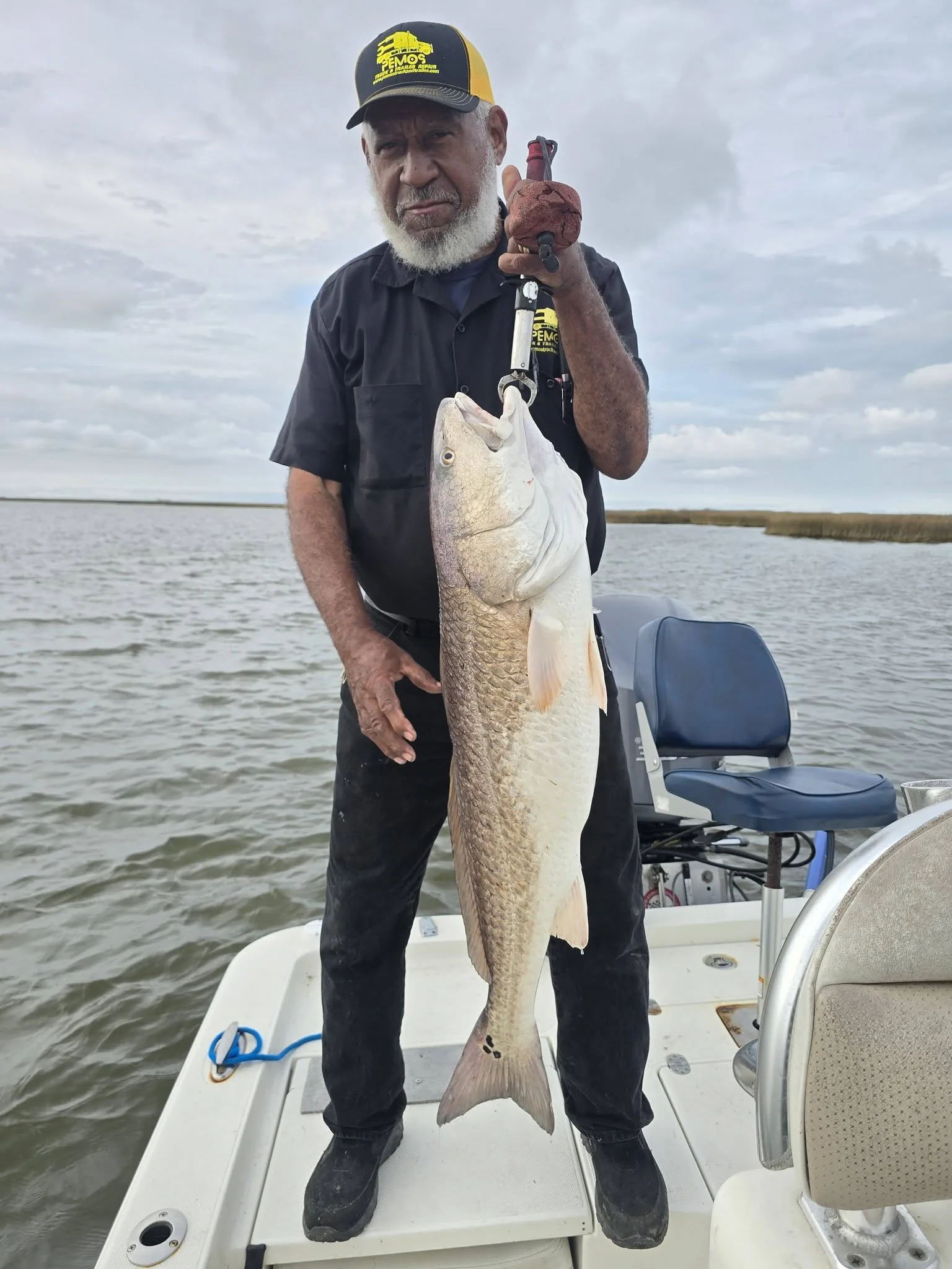 Angler holding a trophy redfish