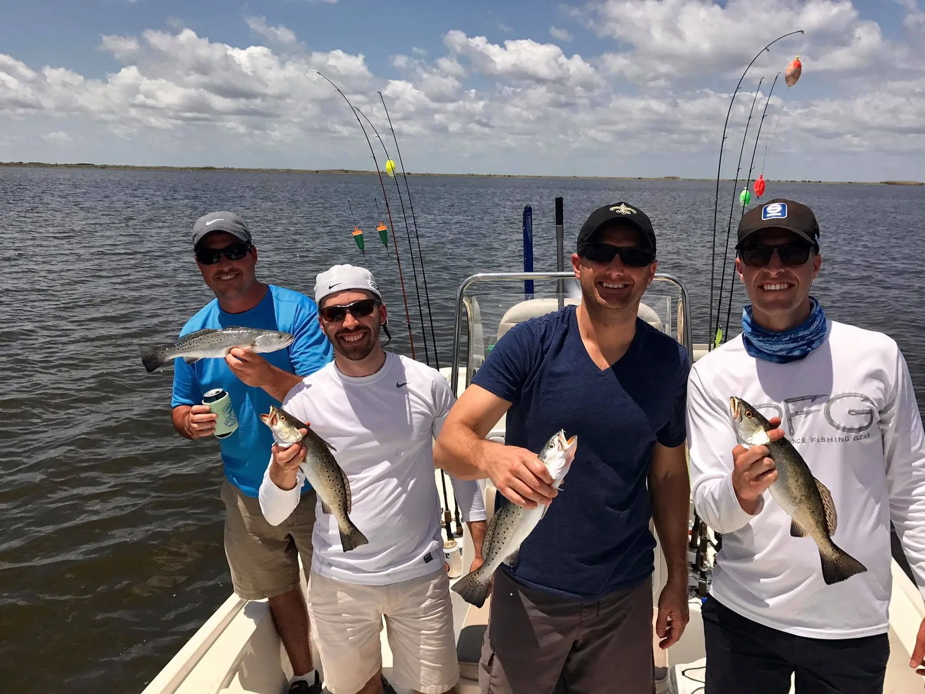Group of anglers smiling with speckled trout
