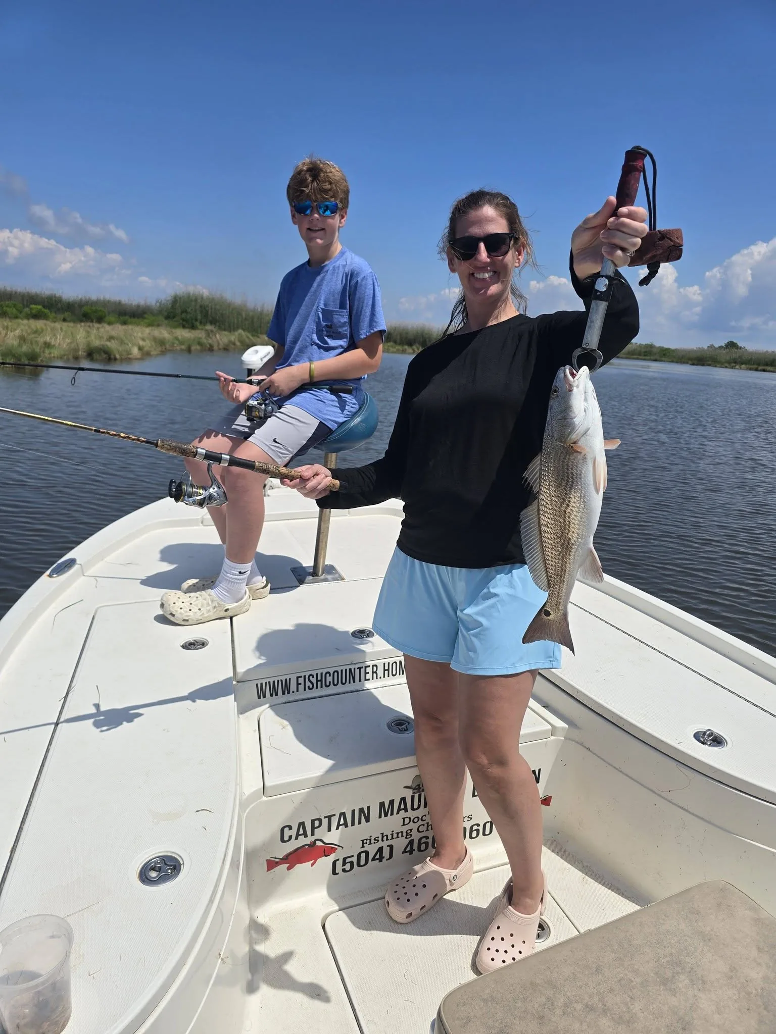Mother and son fishing together
