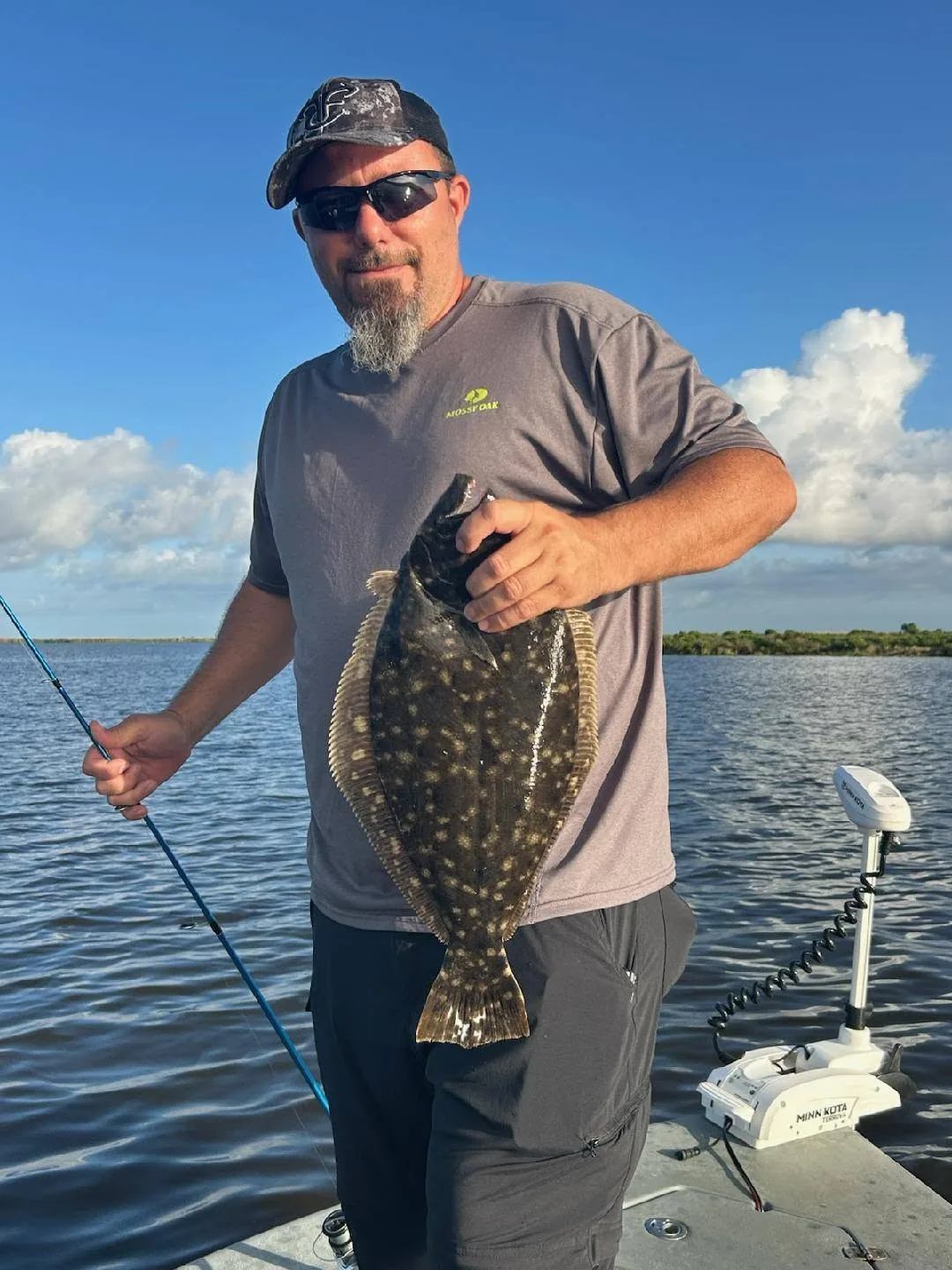 Angler holding a flounder