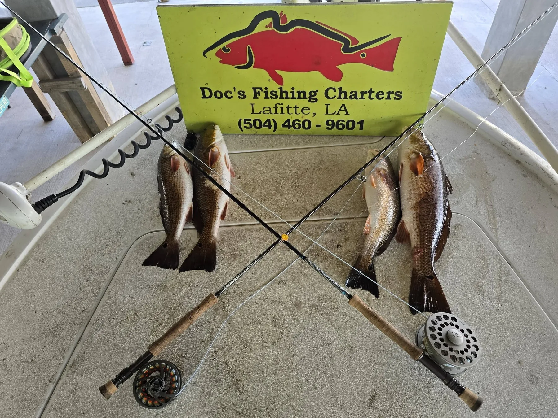 Fly rods and redfish on the boat
